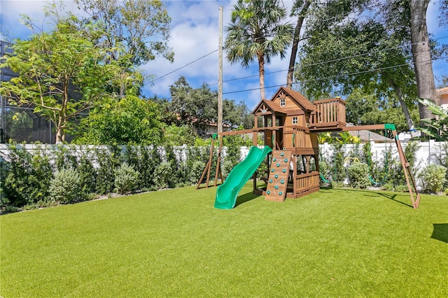 view of play area featuring a lawn