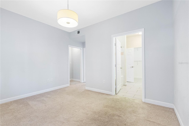 spare room with light carpet