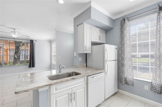 kitchen featuring sink, dishwasher, kitchen peninsula, white cabinetry, and light stone counters