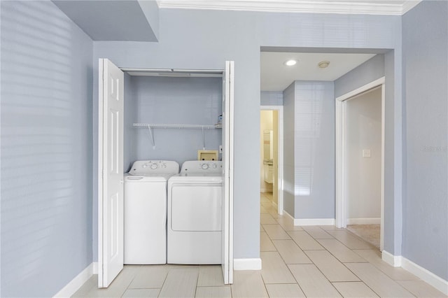 clothes washing area featuring washer and dryer