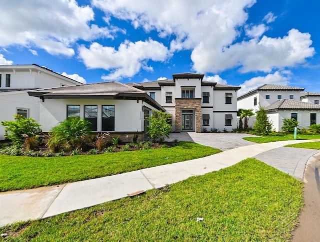 view of front of property with a front lawn