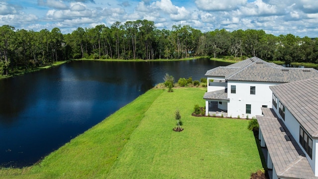 birds eye view of property with a water view