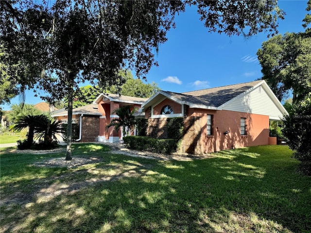 single story home featuring a front yard