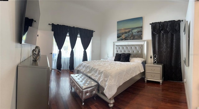 bedroom featuring dark hardwood / wood-style flooring