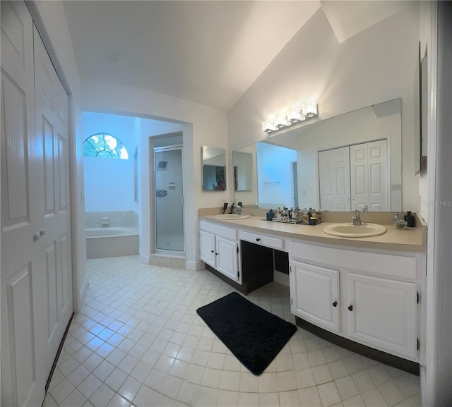 bathroom with vanity, vaulted ceiling, plus walk in shower, and tile patterned flooring