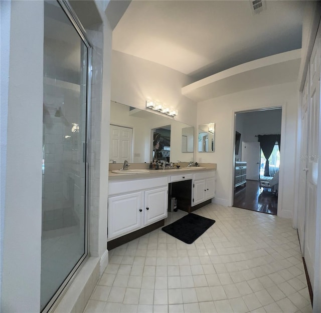 bathroom with vanity, tile patterned floors, and an enclosed shower