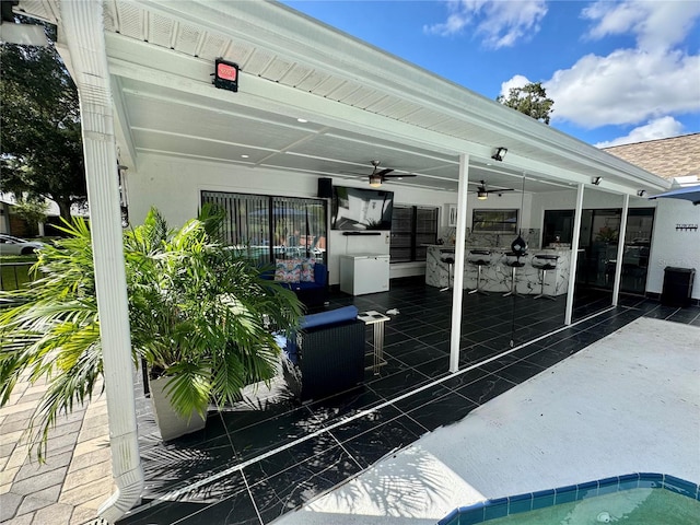 view of patio with ceiling fan