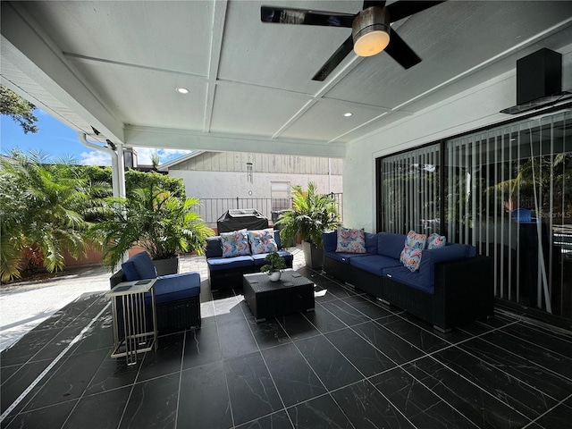 view of patio with an outdoor living space and ceiling fan