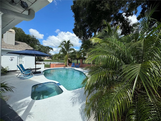 view of swimming pool with a patio area