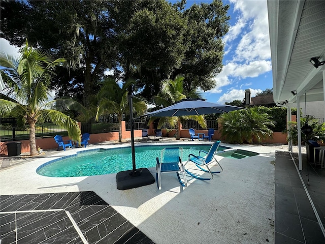 view of swimming pool featuring a patio