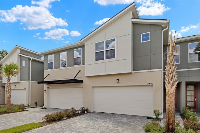 townhome / multi-family property featuring a garage