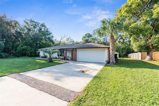 single story home with a garage and a front lawn