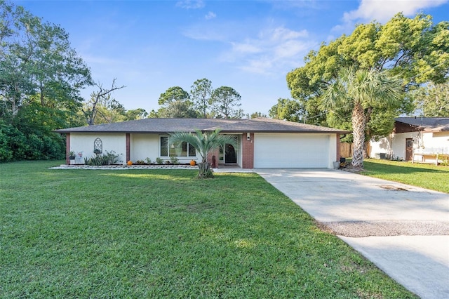 ranch-style house featuring a garage and a front yard