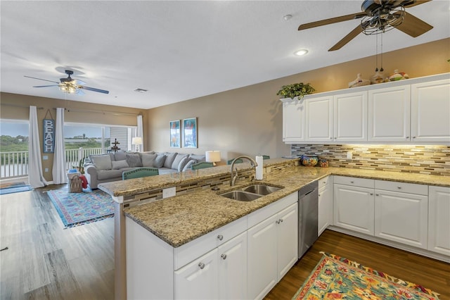 kitchen featuring sink, white cabinets, and kitchen peninsula