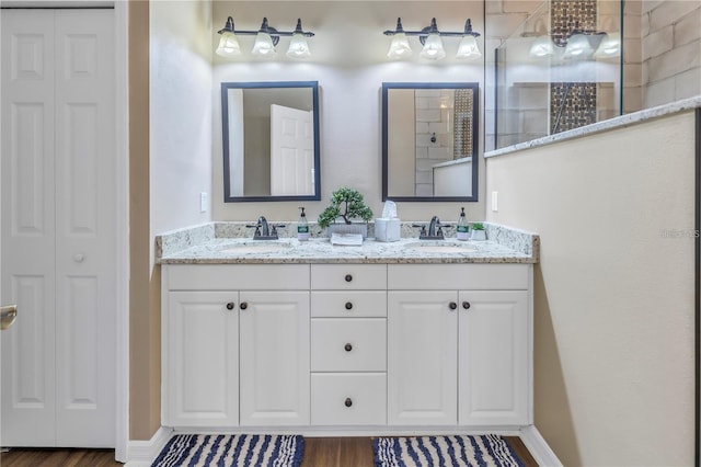 bathroom featuring vanity and hardwood / wood-style floors