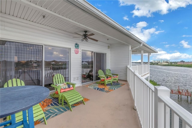 view of patio / terrace with a water view and ceiling fan