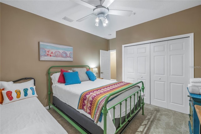 bedroom with a closet, ceiling fan, and dark colored carpet