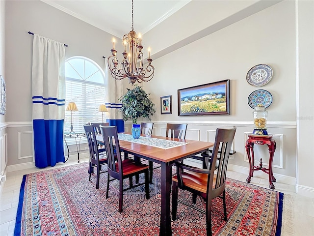 dining room with a notable chandelier and ornamental molding