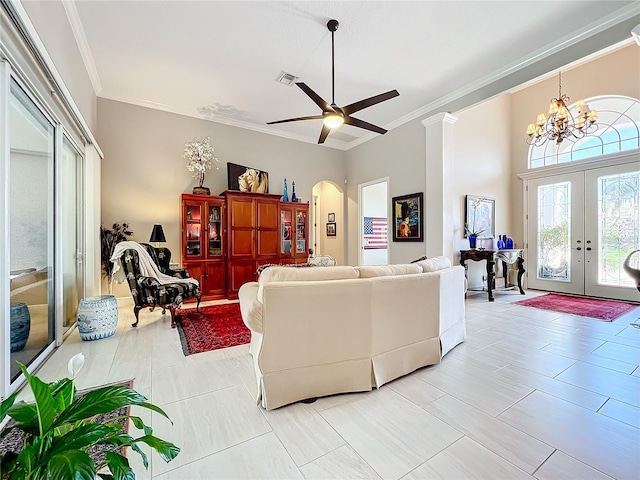 living room featuring ornamental molding, french doors, and ceiling fan with notable chandelier