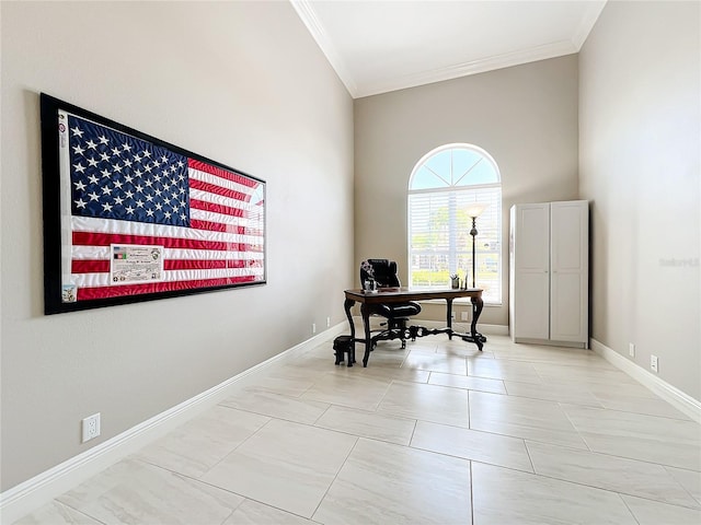 home office featuring a towering ceiling and crown molding