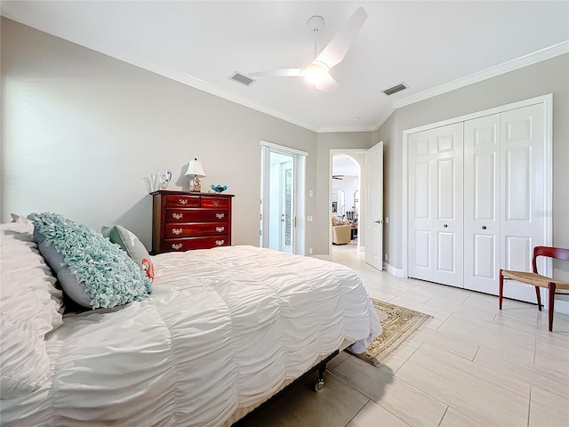 bedroom with a closet, ceiling fan, and ornamental molding