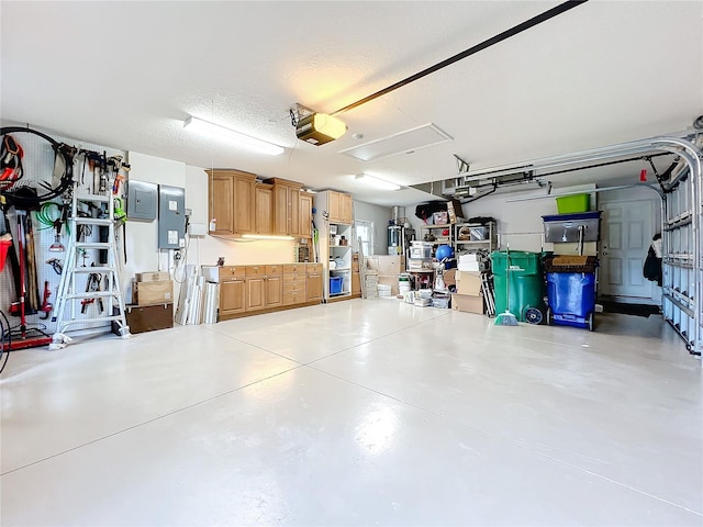 garage featuring a garage door opener and electric panel