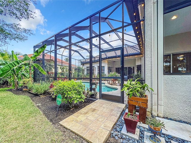 view of patio / terrace featuring a lanai