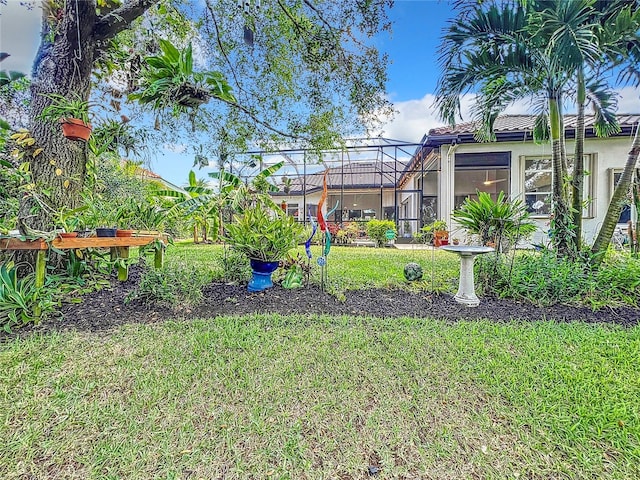 view of yard with a lanai