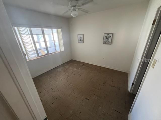 empty room featuring ceiling fan