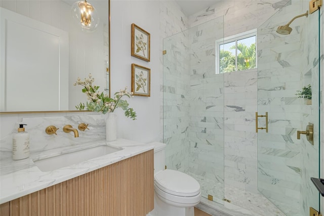 bathroom featuring vanity, toilet, an enclosed shower, and backsplash