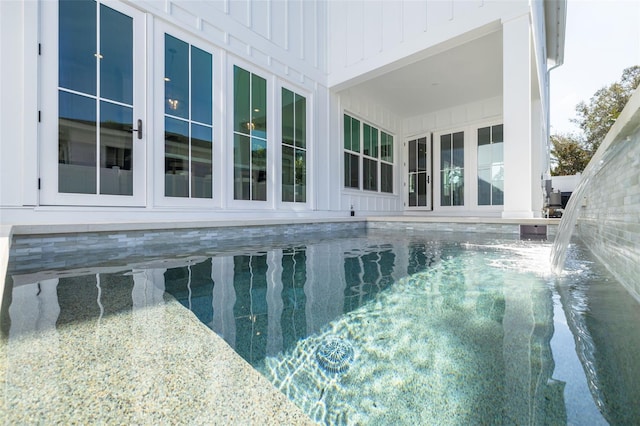 view of swimming pool featuring pool water feature