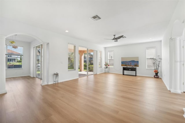 unfurnished living room with light hardwood / wood-style flooring, a healthy amount of sunlight, and ceiling fan