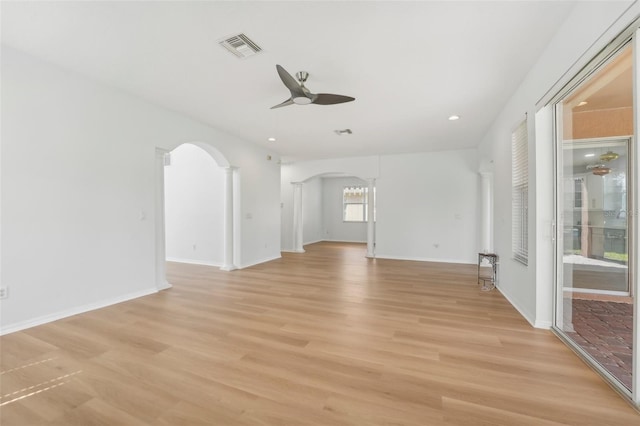 empty room with ceiling fan and light wood-type flooring