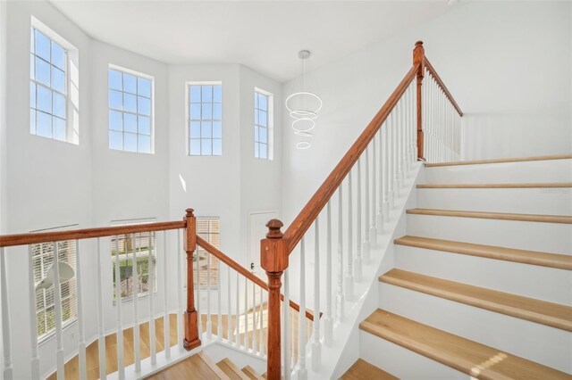 staircase featuring hardwood / wood-style flooring