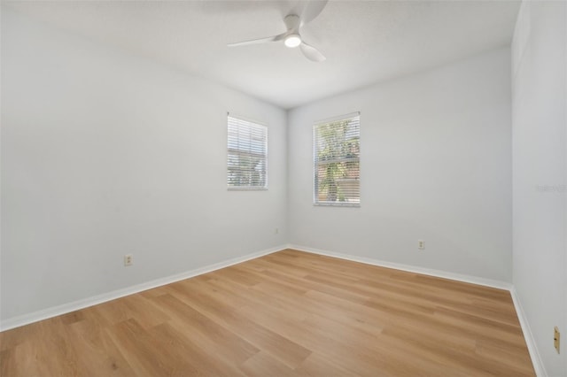 spare room featuring light hardwood / wood-style floors and ceiling fan