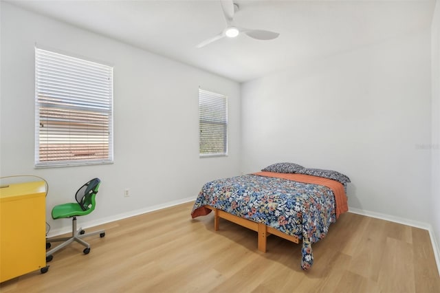 bedroom with wood-type flooring and ceiling fan