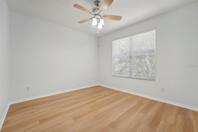 spare room featuring ceiling fan and light hardwood / wood-style flooring