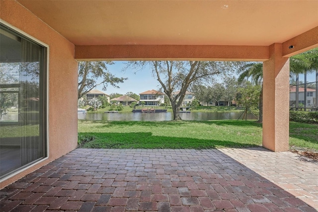 view of patio / terrace with a water view