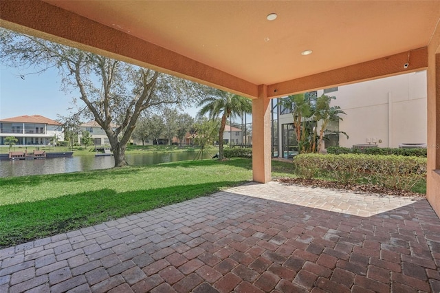 18051 Java Isle Dr, Tampa, FL 33647 - view of patio / terrace with a water view and a residential view