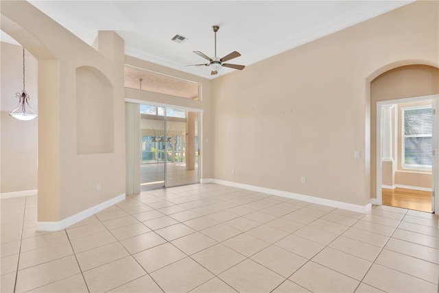 tiled empty room with ceiling fan