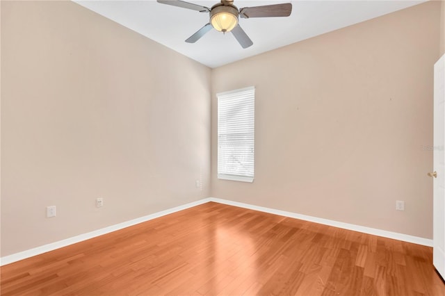 empty room featuring wood-type flooring and ceiling fan