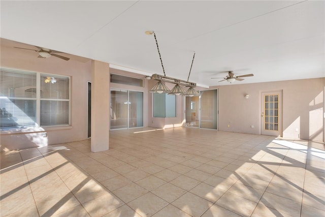 interior space featuring ceiling fan