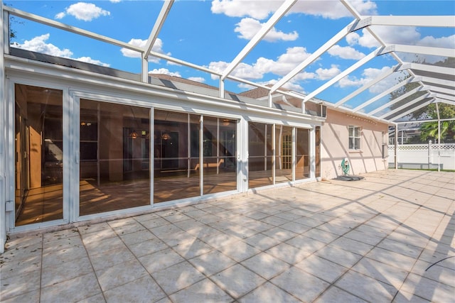 unfurnished sunroom with vaulted ceiling