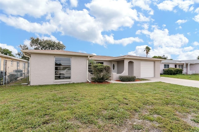 single story home featuring a front yard, fence, stucco siding, concrete driveway, and a garage