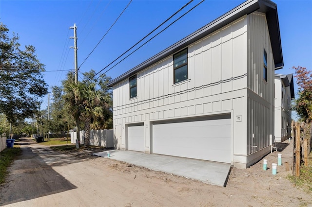 view of property exterior with a garage