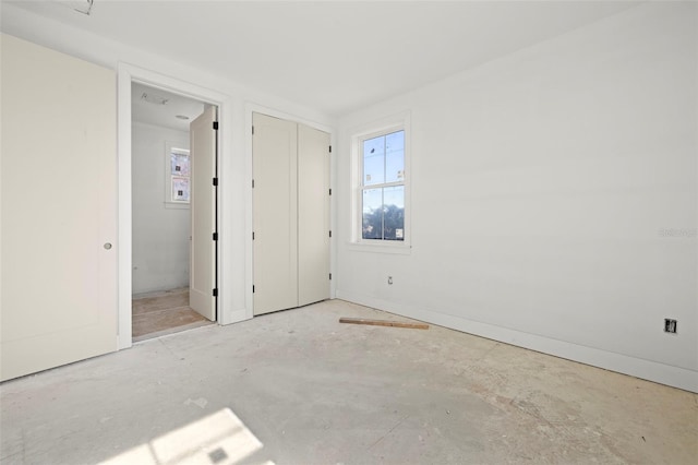 unfurnished bedroom featuring ensuite bathroom