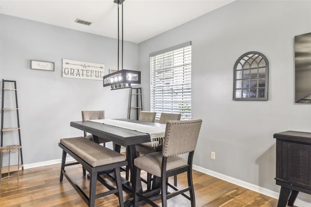 dining room with hardwood / wood-style flooring