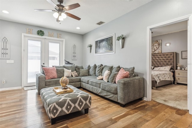 living room featuring french doors, hardwood / wood-style floors, and ceiling fan