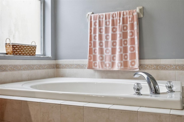 bathroom with tiled bath