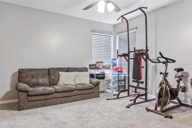 exercise room with carpet flooring and ceiling fan